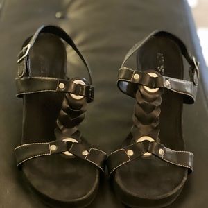 Aerosols, wedge heal with braided design. Gently worn.